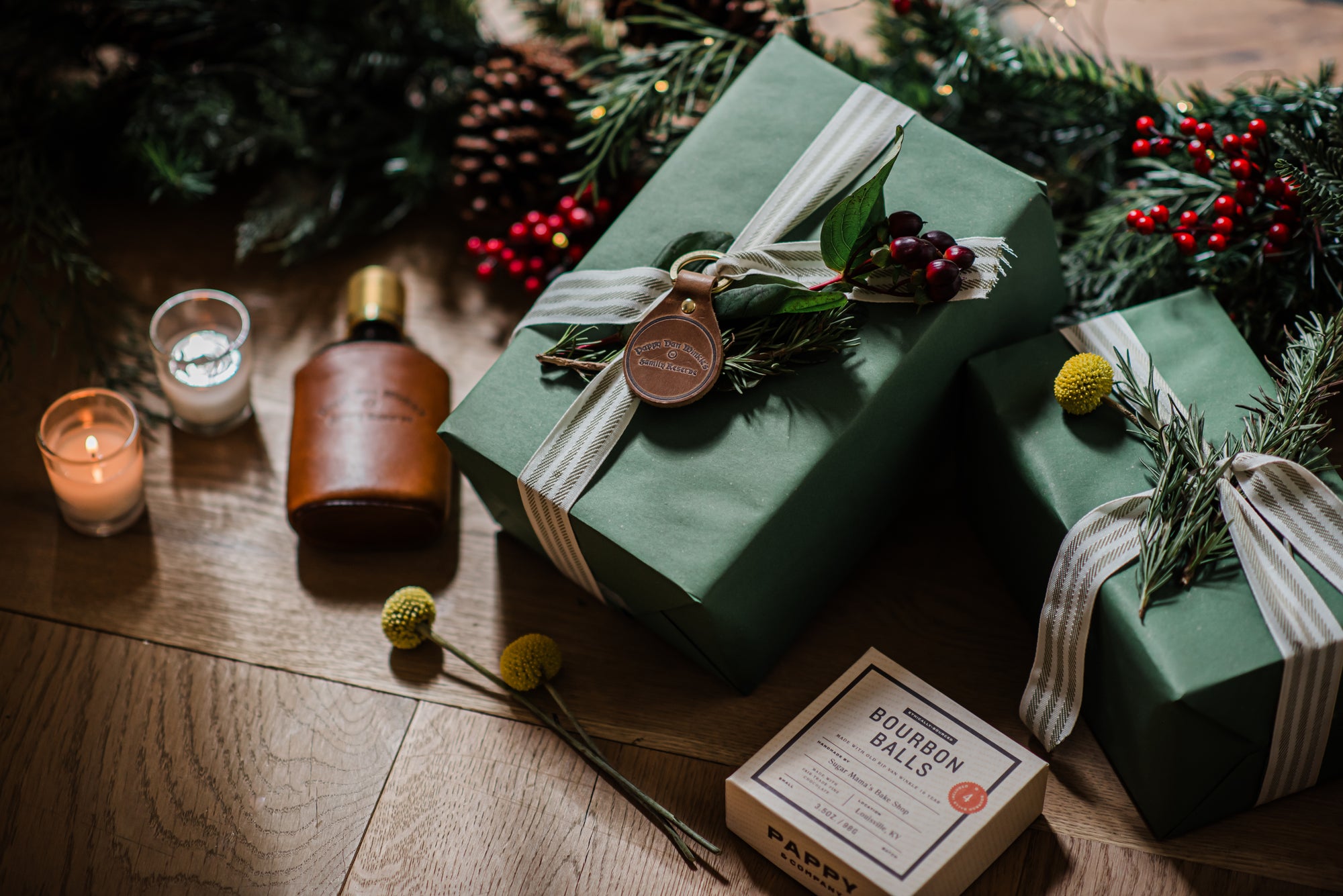 Pappy & Company presents and stocking stuffers with Christmas greenery.